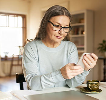 Older woman looking at phone