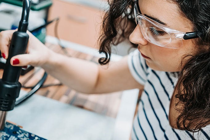 woman working on a board