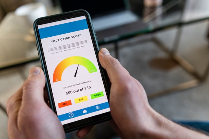 Person looking at credit score on the phone